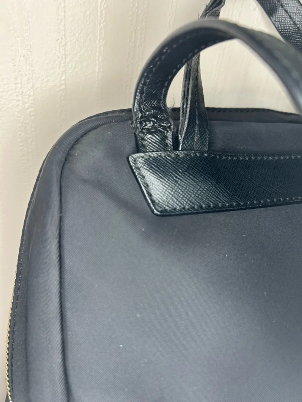 Kate Spade Blake Ave black nylon mini backpack with gold hardware